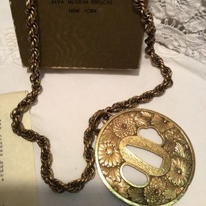 Tuba Sword Guard. Gold electroplate museum replica